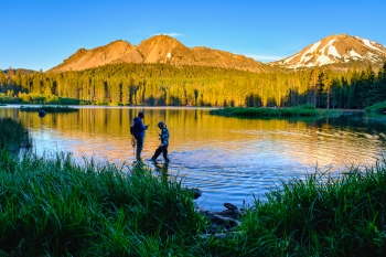 Father-Daughter Fly Fishing at Sunset