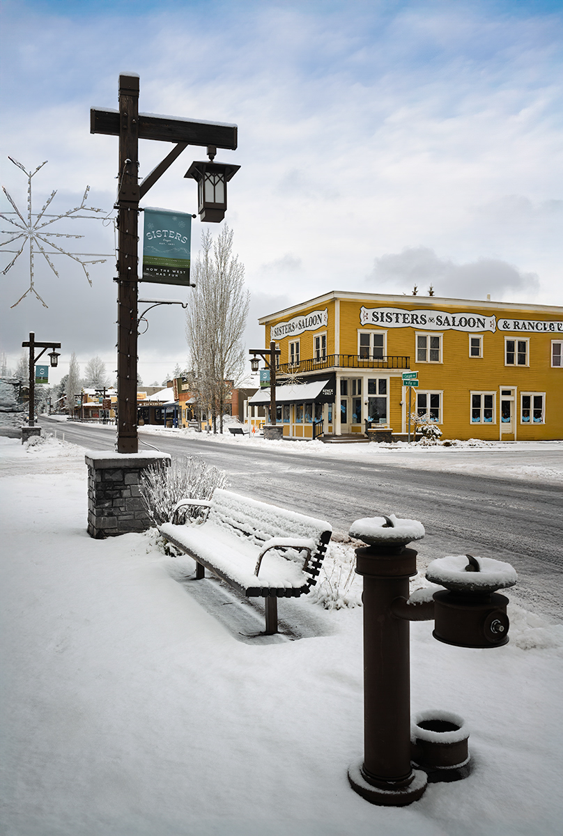 File Upload from your device, properly sized as above, and in the proper name format, as above: Sisters-Saloon-and-Ranch-Grill-in-Snow-by-Blanche-Feekes-2025-01-T